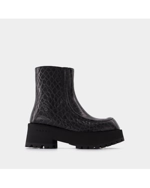 Botas negras de piel con cremallera