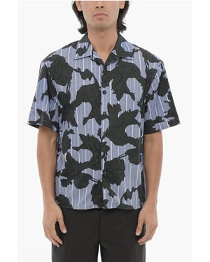 Camisa de corte cuadrado con motivo floral en azul y negro