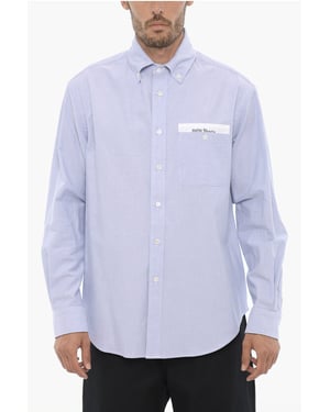 Camisa de algodón piqué con botones y bolsillo en el pecho en azul claro
