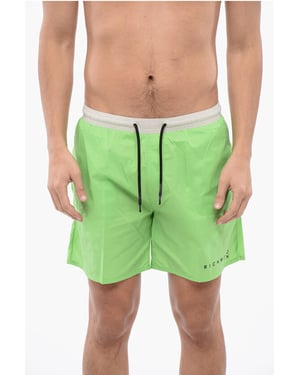 Traje de baño bóxer bicolor en blanco y verde