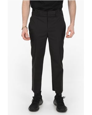 Pantalones negros de corte ajustado con trabillas para cinturón y 4 bolsillos