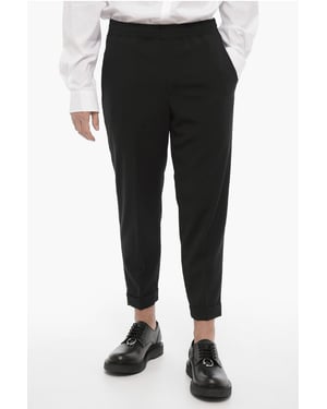 Pantalones casuales ajustados con dobladillo con puños en negro