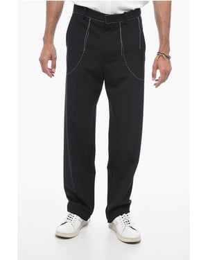 Pantalones de sastrería con detalles de costura en negro
