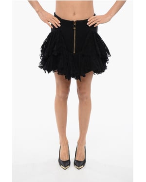 Minifalda de encaje con volantes y cremallera trasera en negro