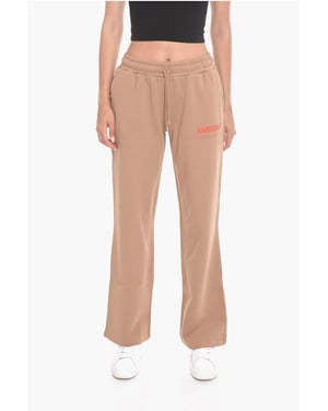 Joggers WORKSHOP de pierna ancha con estampado de logotipo en beige