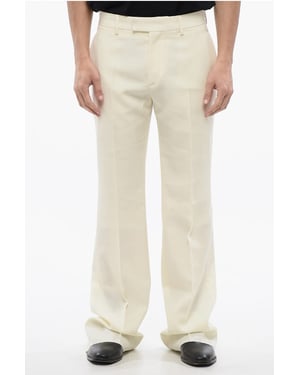Pantalones acampanados en beige