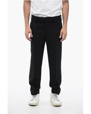 Pantalones negros de mezcla de lana con dobladillo metálico y tiro regular