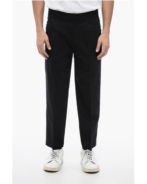 Pantalones de mezcla de lino de corte cónico con doble pliegue en negro