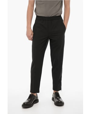 Pantalones ajustados con cremallera en el tobillo en negro