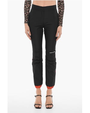 Pantalones de nailon con cremallera en el tobillo en color negro