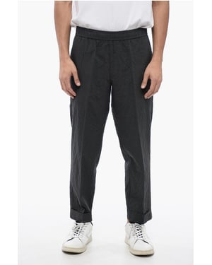 Pantalones REM de algodón arrugado en gris