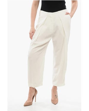Pantalones de viscosa de corte cónico con pliegues simples en blanco