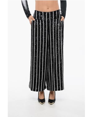 Pantalones de cintura alta con rayas y lentejuelas en blanco y negro