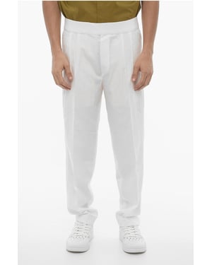Pantalones ajustados con doble pliegue y cintura elástica en blanco