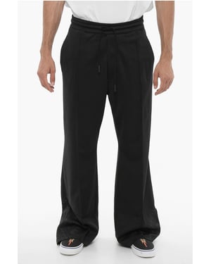 Pantalones deportivos de pierna ancha con cordón en la cintura en negro