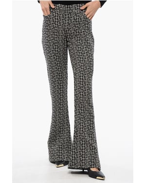 Pantalones acampanados de tiro bajo de lana en blanco y negro