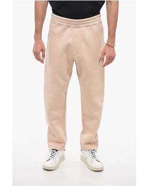 Joggers BOLT bordados con cremallera en los puños en beige