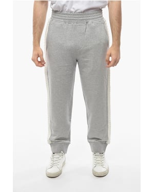 Pantalones deportivos holgados de algodón con bandas laterales de punto en gris