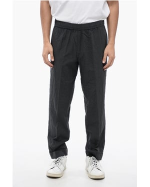 Pantalones REM de algodón arrugado en gris