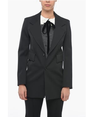 Blazer de lana elástica con mangas curvas en negro