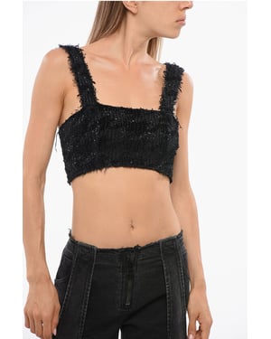 Top corto de color liso adornado con lentejuelas en negro