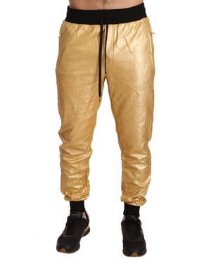 Pantalones deportivos metálicos dorados Dolce Gabbana