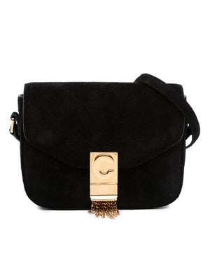 Bolso de ante tipo bandolera con borlas