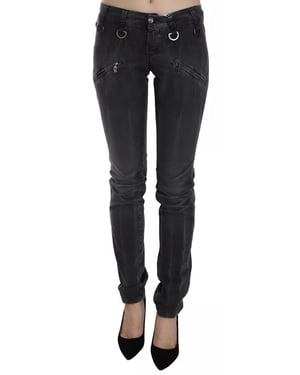 Jeans de mezclilla skinny de tiro bajo con cremallera lateral en gris desgastado de John Galliano