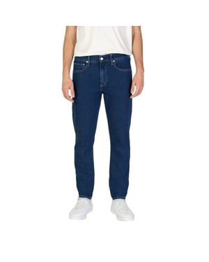 Jeans de corte ajustado en lavado oscuro