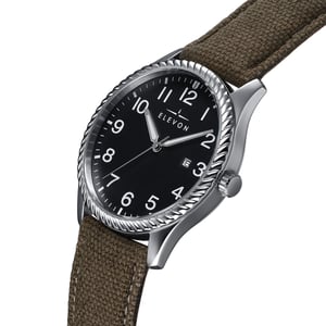 Reloj Elevon Crosswind con correa de cuero superpuesta en lona y fecha