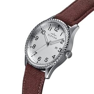 Reloj Elevon Crosswind con correa de cuero superpuesta en lona y fecha