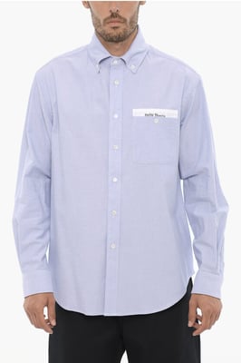 Camisa de algodón piqué con botones y bolsillo en el pecho en azul claro