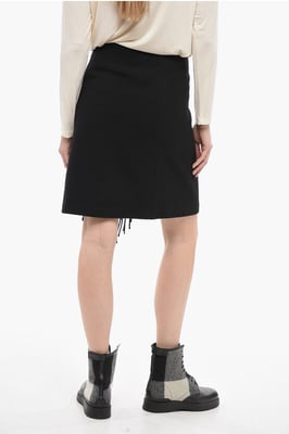 Falda cruzada con flecos en negro