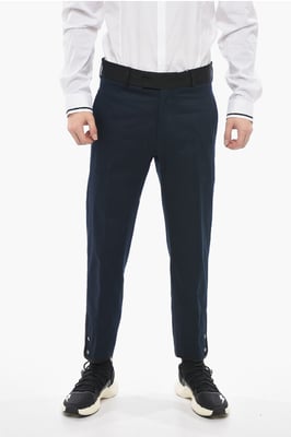Pantalones TOM Slim Fit con bordes en contraste y botones en los tobillos en azul