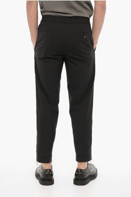 Pantalones ajustados con cremallera en el tobillo en negro