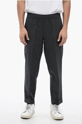 Pantalones REM de algodón arrugado en gris