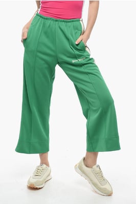 Pantalones acampanados deportivos con bandas laterales en contraste en verde