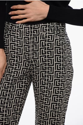 Pantalones acampanados de tiro bajo de lana en blanco y negro