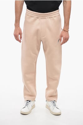 Joggers BOLT bordados con cremallera en los puños en beige