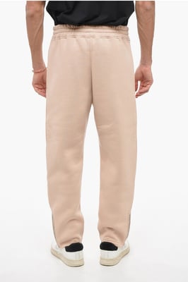 Joggers BOLT bordados con cremallera en los puños en beige