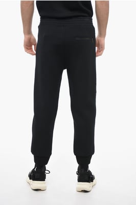 Pantalones deportivos ajustados de neopreno para motociclistas en negro