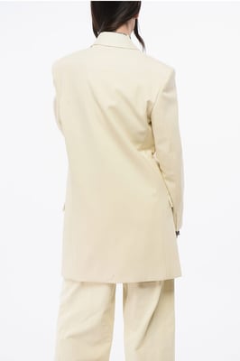 Blazer de lana MM0 de dos botones con bolsillos de solapa en beige