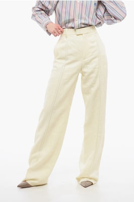 Pantalones de lino puro con pinzas delanteras bordadas en amarillo