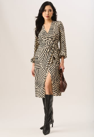 Vestido midi cruzado con dobladillo asimétrico y estampado geométrico