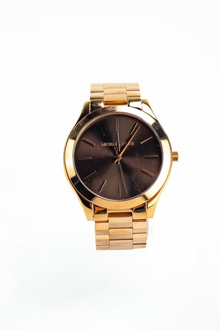 Reloj de pulsera con esfera marron de acero inoxidable en tono dorado