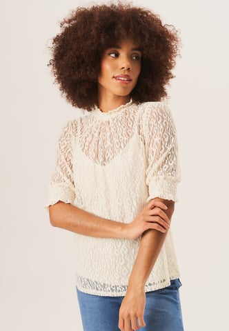 Blusa holgada de encaje con cuello alto