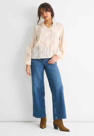Blusa de manga larga en jacquard floral crema