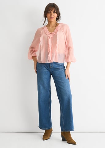 Blusa de manga larga con detalle de lazo y volantes