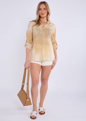 Top oversize con mangas remangables en denim beige