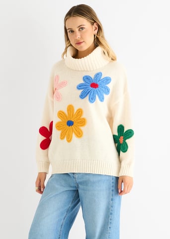 Jersey oversize con apliques florales en color crema